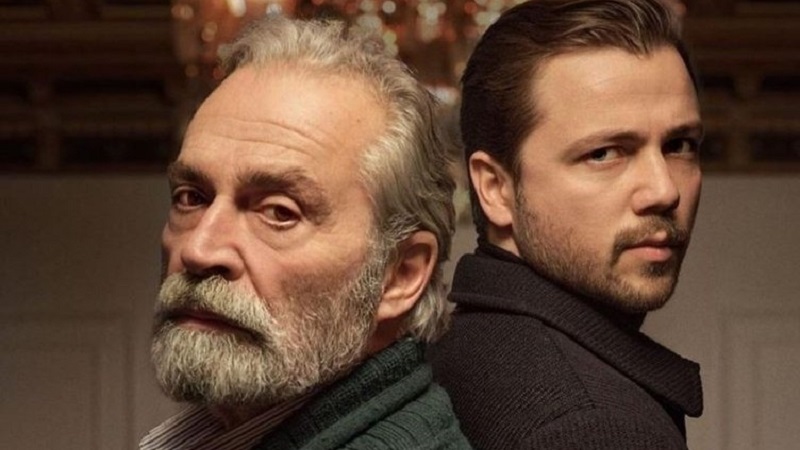 The Baba series, starring Tolga Sarıtaş and Haluk Bilginer, will make its finale soon Baba series dizi close up face of Tolga Sarıtaş wearing a brown jacket and Haluk Bilginer with grey hair, staying back to back