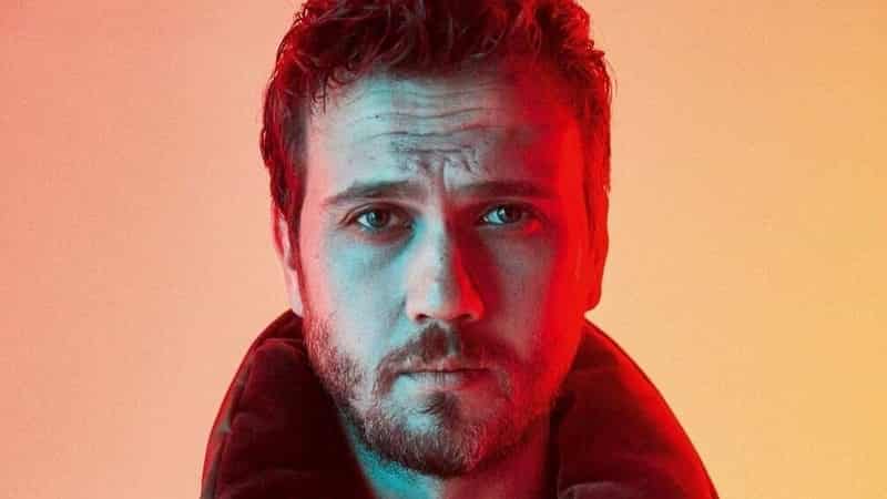 Bomb news from Aras Bulut İynemli regarding his career No acting for 1 year Disney Plus's Atatürk series dizisi-min Aras Bulut İynemli close up face with bear and a strong light from right, Disney Plus Atatürk series dizi dizisi