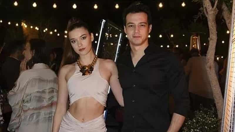 Separation statement from Afra Saraçoğlu the leading actress of Yali Capkini, broke up with Mert Yazıcıoğlu-min Afra Saraçoğlu wearing a pink dress with belly out at the arm of her ex-boyfriend Mert Yazıcıoğlu wearing a black t-shirt yali capkini dizi series