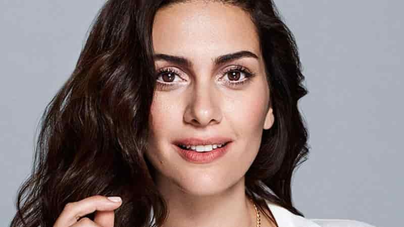 Bergüzar Korel close up face with long and black hair and big large eyes, in new turkish drama series first dizi in collaboration with ogm and amazon prime video