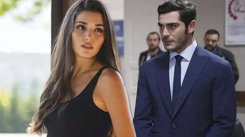 actors Hande Erçel wearing black shirt looking at Burak Deniz wearing a blue suit in the new turkish tv series Bambaşka Biri cannnes MIPCOM 2023